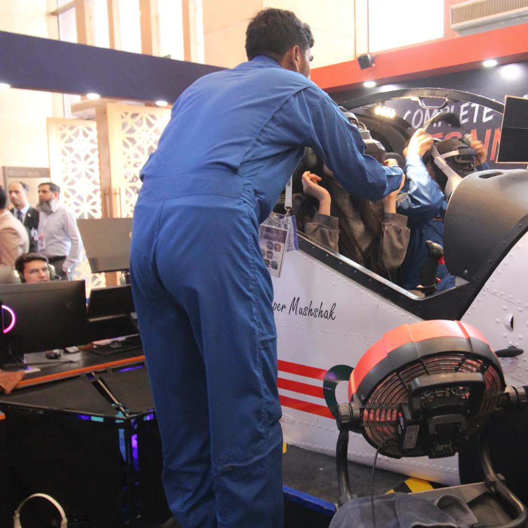 An FSDC engineer preparing the simulator cockpit between demonstration slots