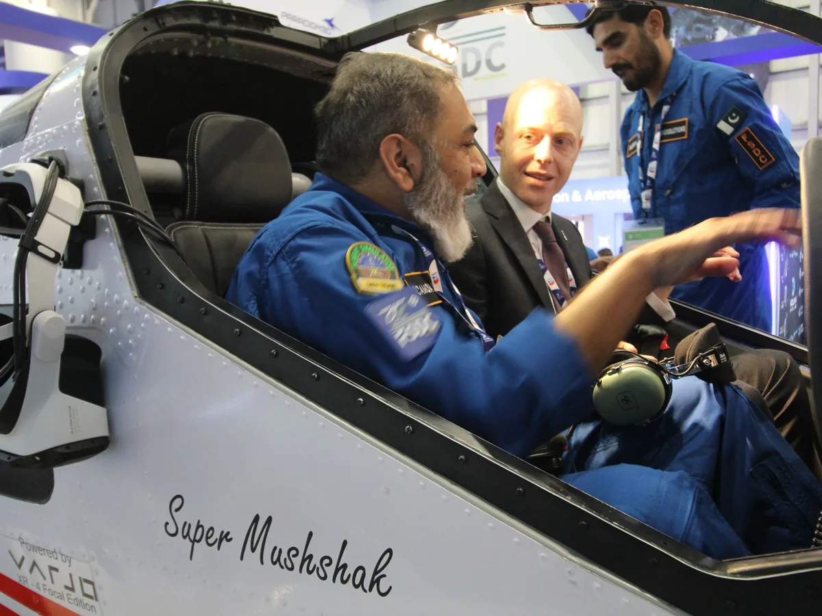 An FSDC engineer briefing a visitor in the AeroMix cockpit