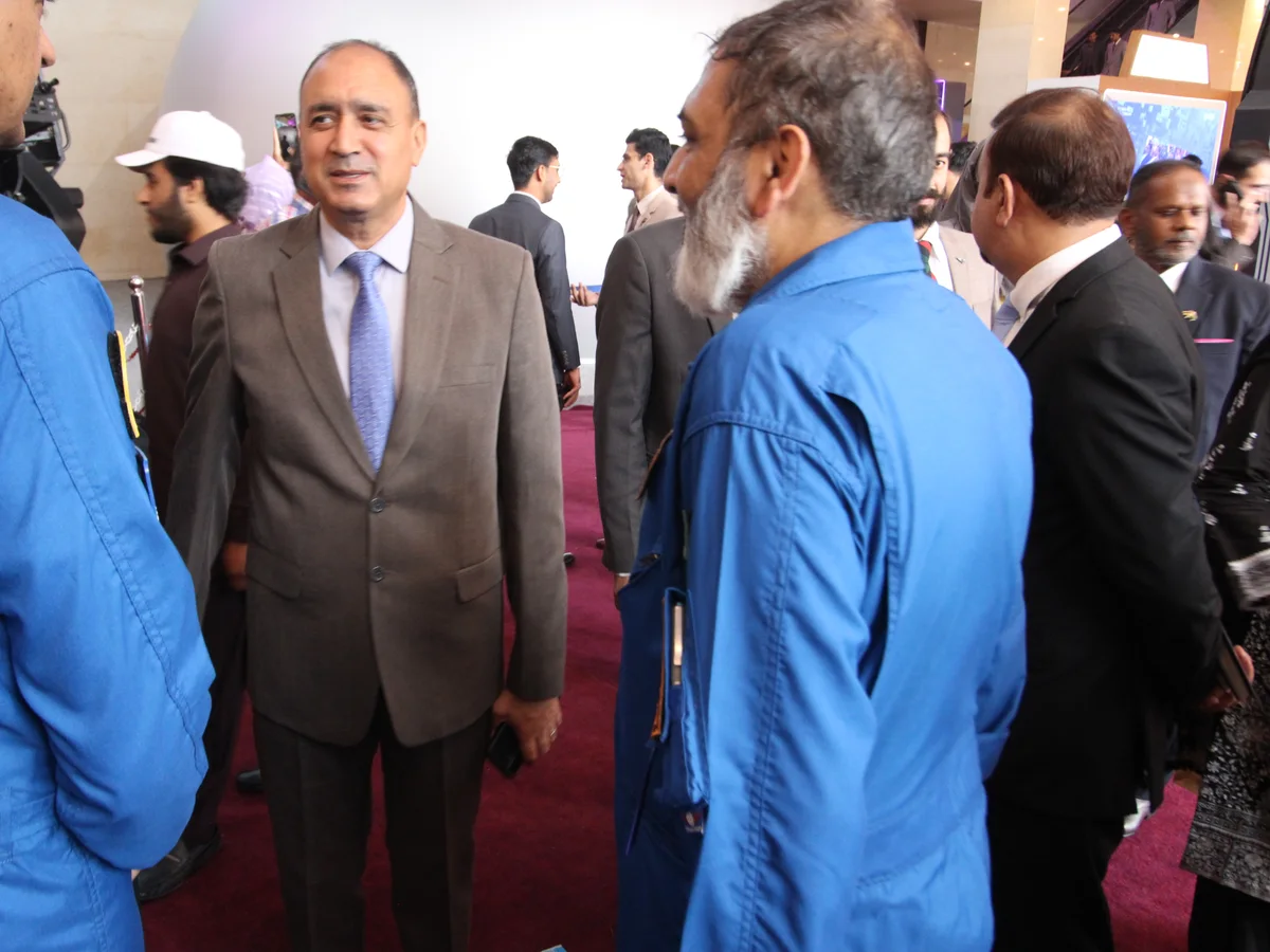 An FSDC engineer briefing a guest at the Indus RAS Expo 2026 stand