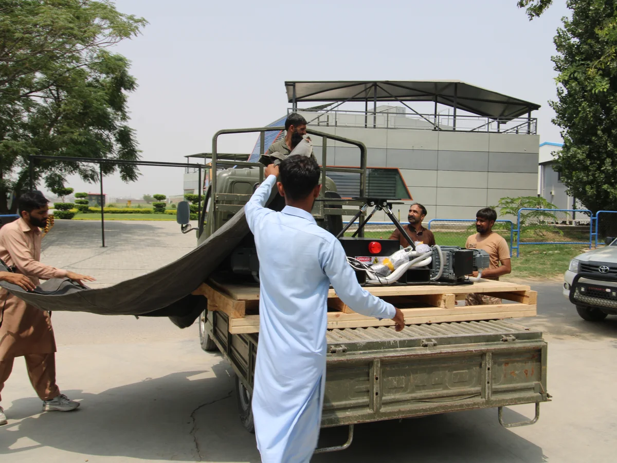 Loading a crated simulator onto a truck