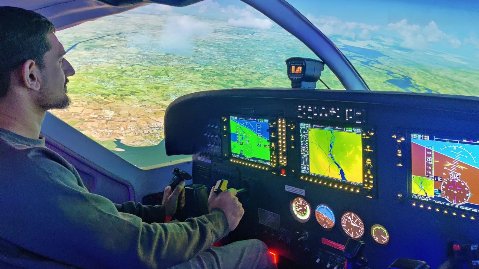 A pilot flying the Cessna 208 full-motion simulator